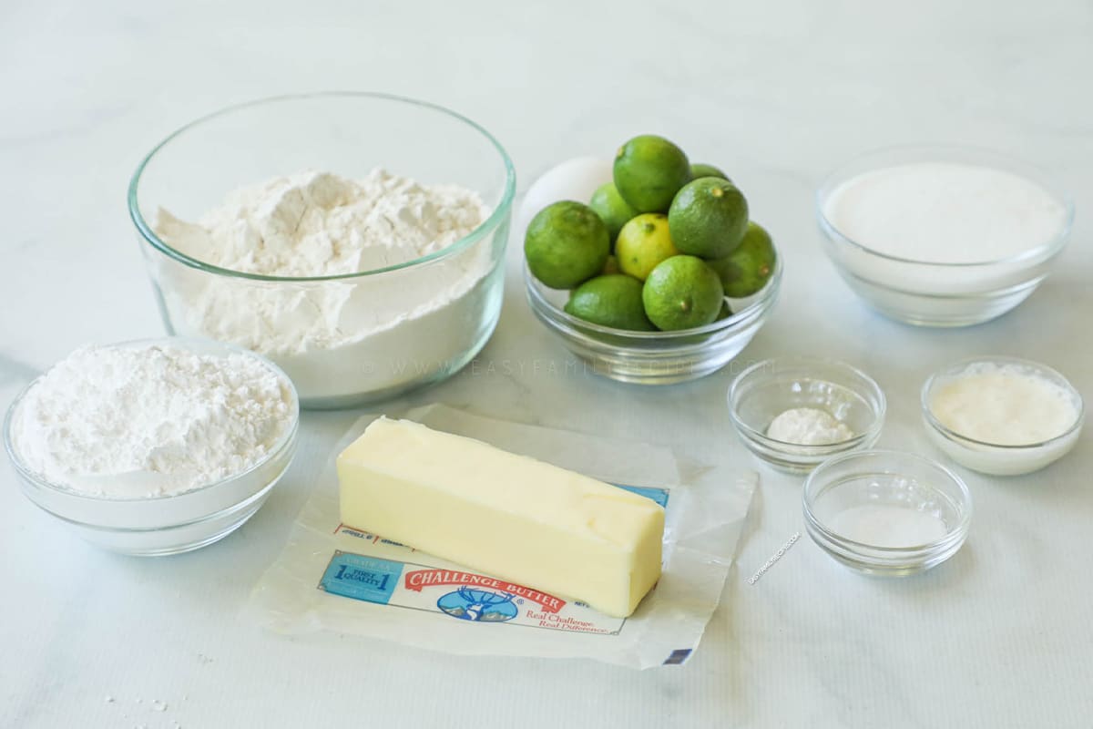 Ingredients to make key lime cookies including flour, sugar, salt, key limes, butter, egg, and mroe.