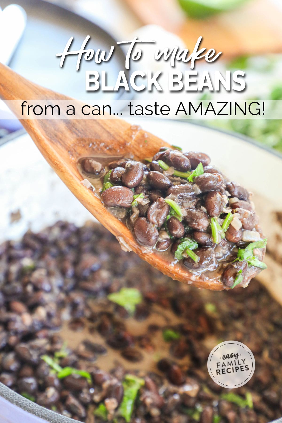 Spoon lifting canned black beans seasoned with cilantro from pot