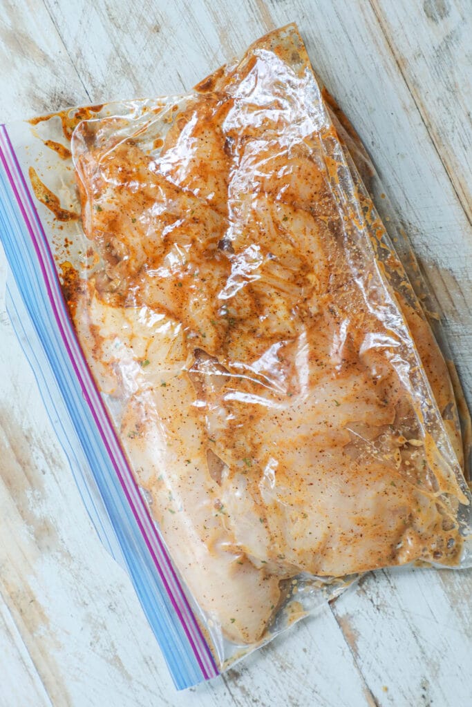 Step 1 to make pineapple salsa chicken - marinade chicken