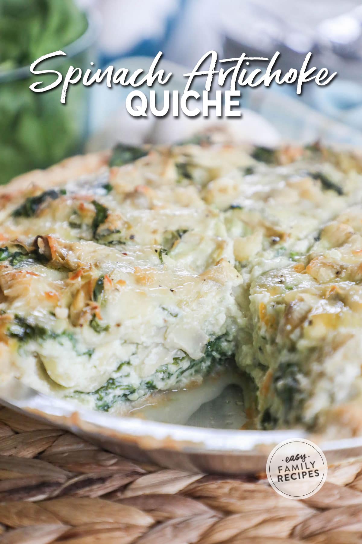 Side view of sliced Spinach Artichoke Quiche filled with eggs, spinach, artichoke and cheeses.