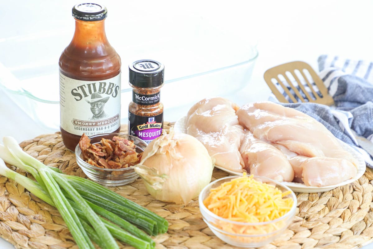 Ingredients for Mesquite Chicken including chicken breast, BBQ sauce, Mesquite seasoning, onion, cheese, and green onion.