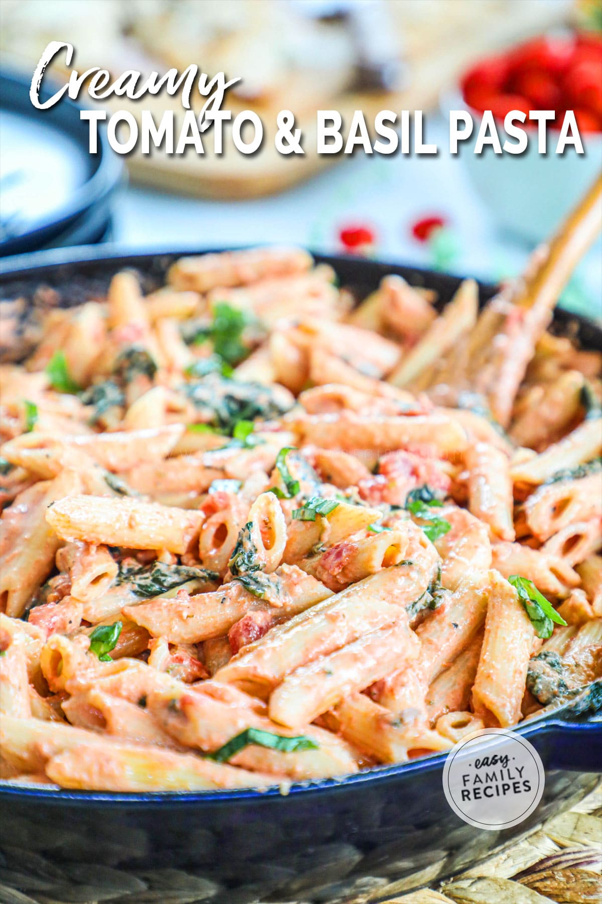 Close up of tomato and basil pasta in large skillet ready to be served