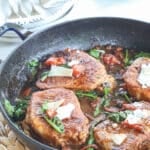 Tuscan Pork Chop recipe prepared and ready to serve for dinner.