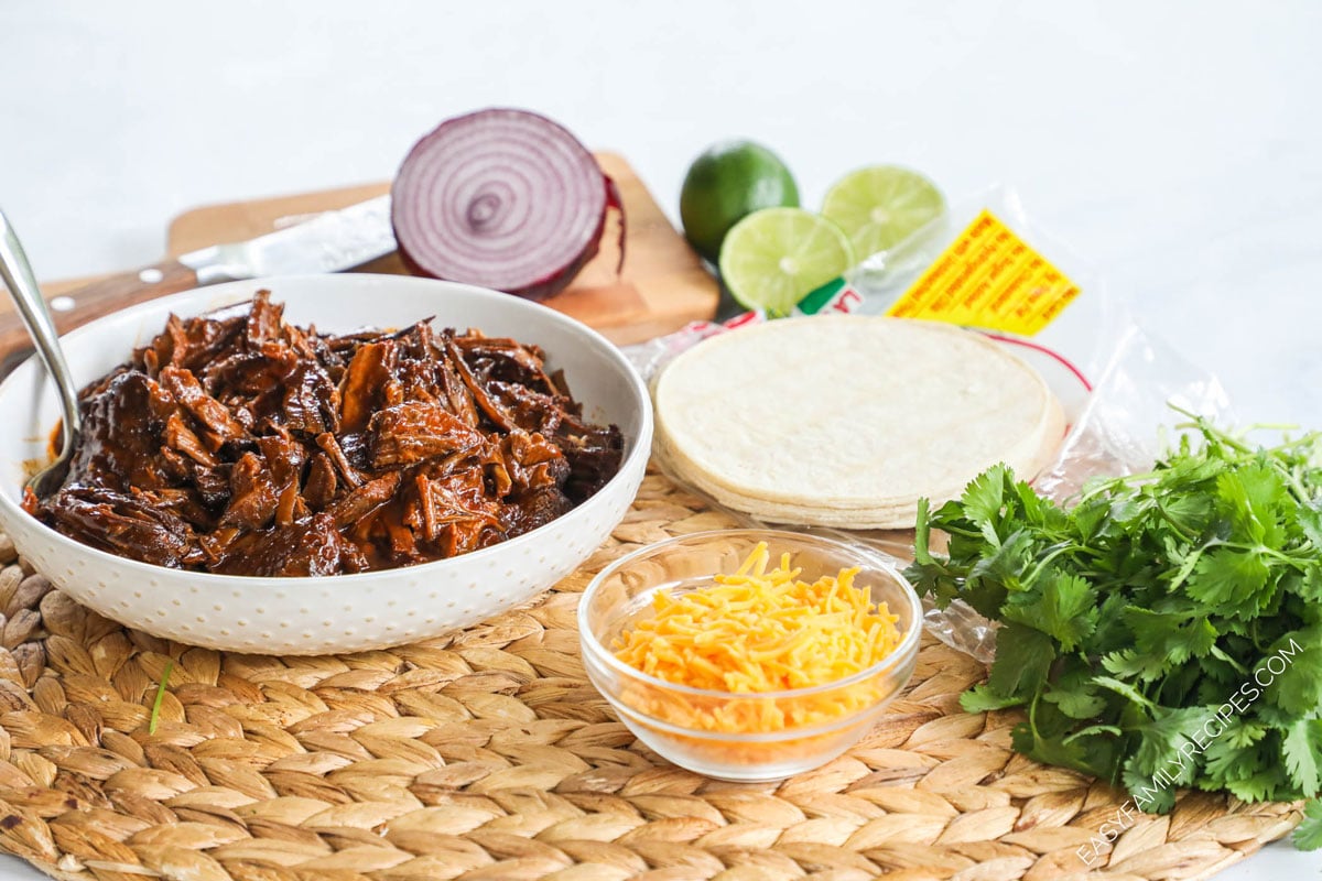 Ingredients for Brisket Taco Recipe - Leftover brisket, corn tortillas, cilantro, cheese, sour cream, pico de gallo