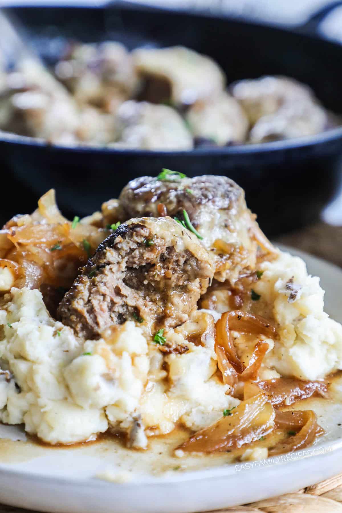 Beef French Onion Meatballs served on top of mashed potatoes