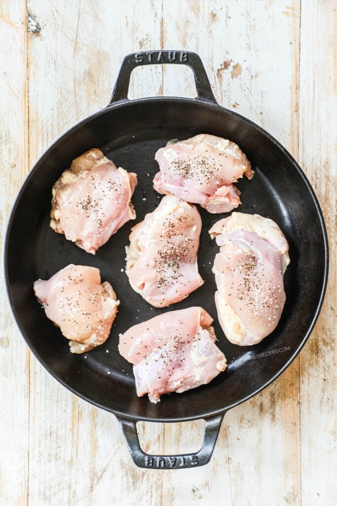 How to make honey garlic chicken step 1: Season chicken thighs and place in a hot skillet.