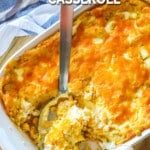 Casserole dish filled with Jiffy Corn Casserole topped with cheese.