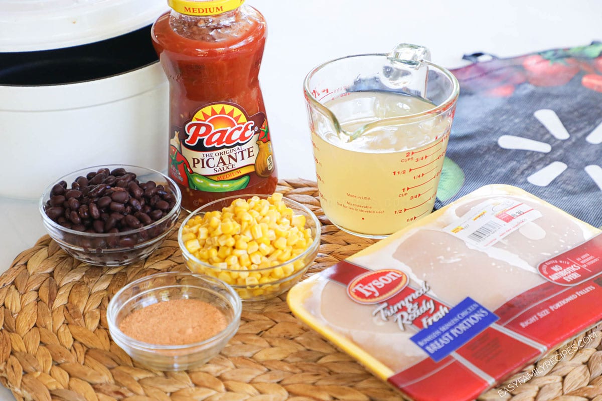 Ingredients for Salsa Chicken Soup including: chicken breast, salsa, corn, beans, chicken broth, lime