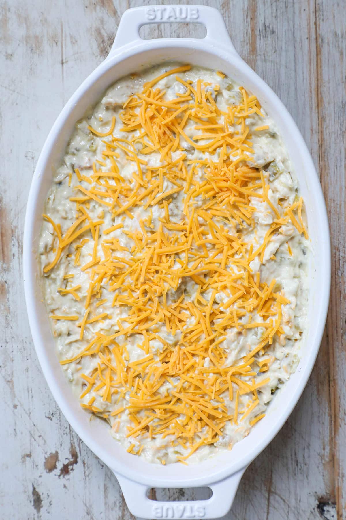 Step 4 of Green Chile Chicken Casserole Recipe - Top w cheese and bake