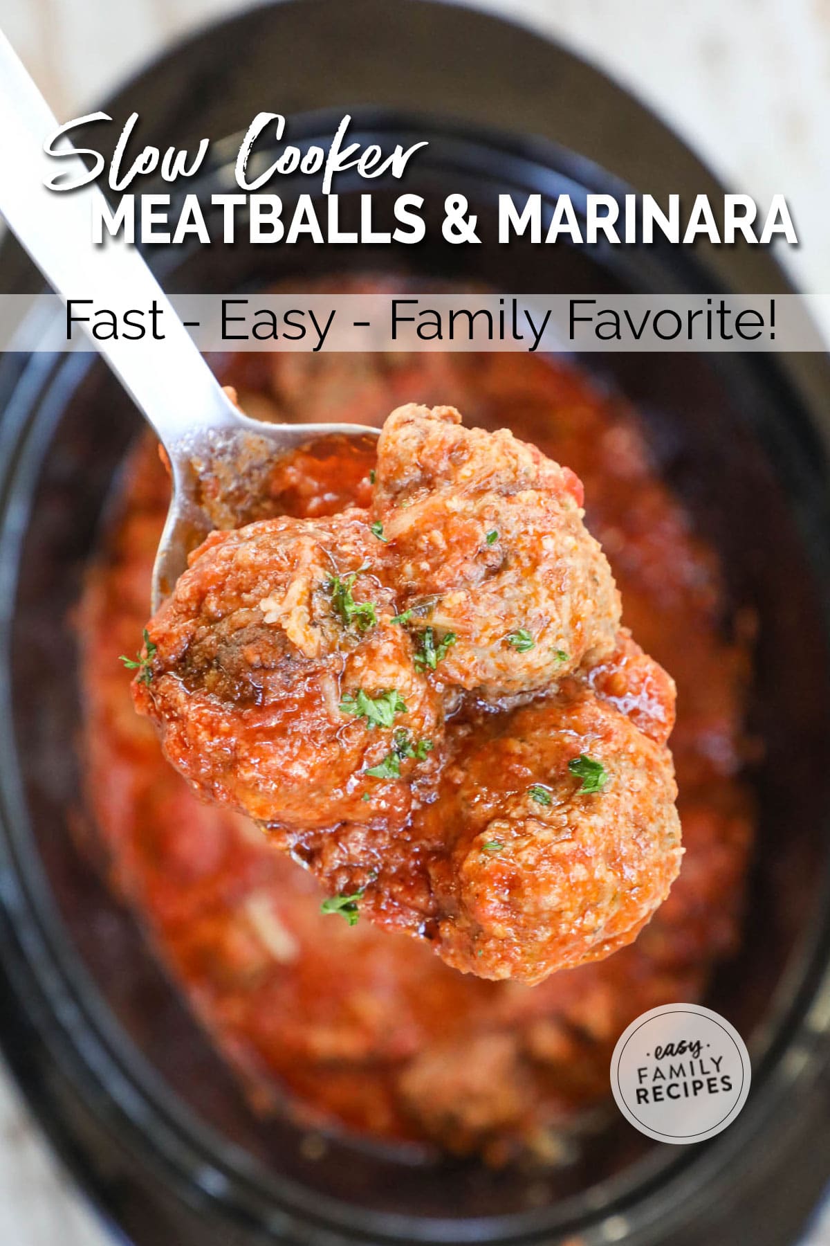 ifting 3 beef Italian Meatballs in marinara out of the crock pot