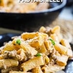 Cheeseburger pasta served from the skillet onto a plate