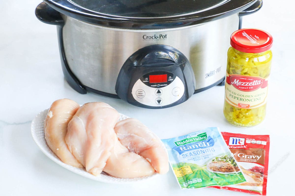 Mississippi Chicken Ingredients - Chicken breast, ranch seasoning, gravy mix, peperoncini peppers