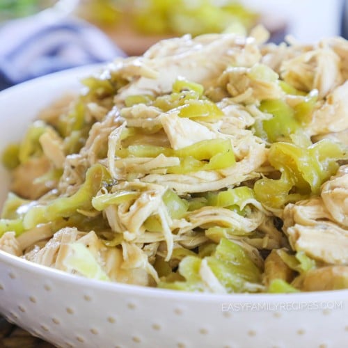 Shredded Mississippi Chicken made in a crockpot then piled high in a bowl ready to serve for an easy dinner