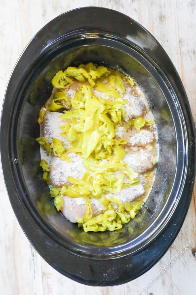 How to make Mississippi Chicken in crockpot Step 3: Add pepperoncini peppers. Cover and cook.