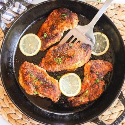 Blackened Chicken Breast with Lemon in a cast iron pan