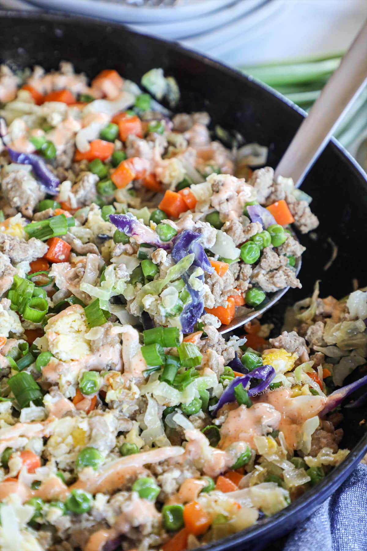 stir fried ground turkey with cabbage and frozen vegetables in a skillet