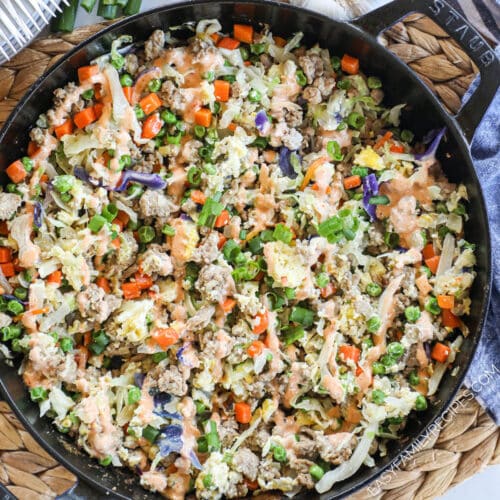 stir fried ground turkey with cabbage and frozen vegetables in a skillet