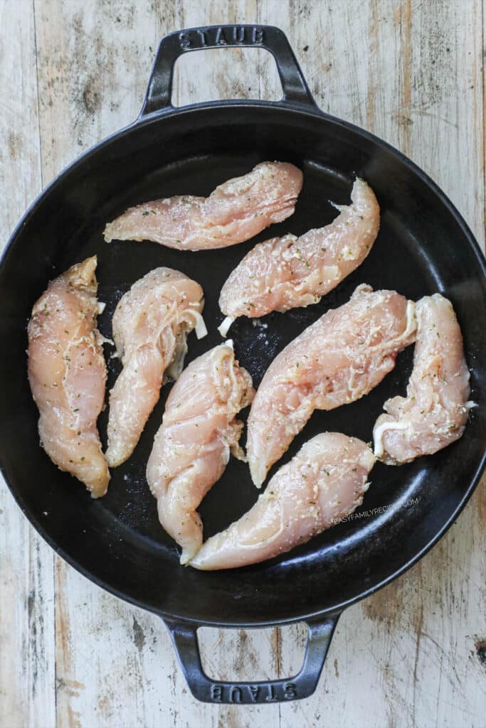 How to make Buffalo Chicken Tenders with no breading step 2: Place seasoned chicken tenders in a hot skillet.