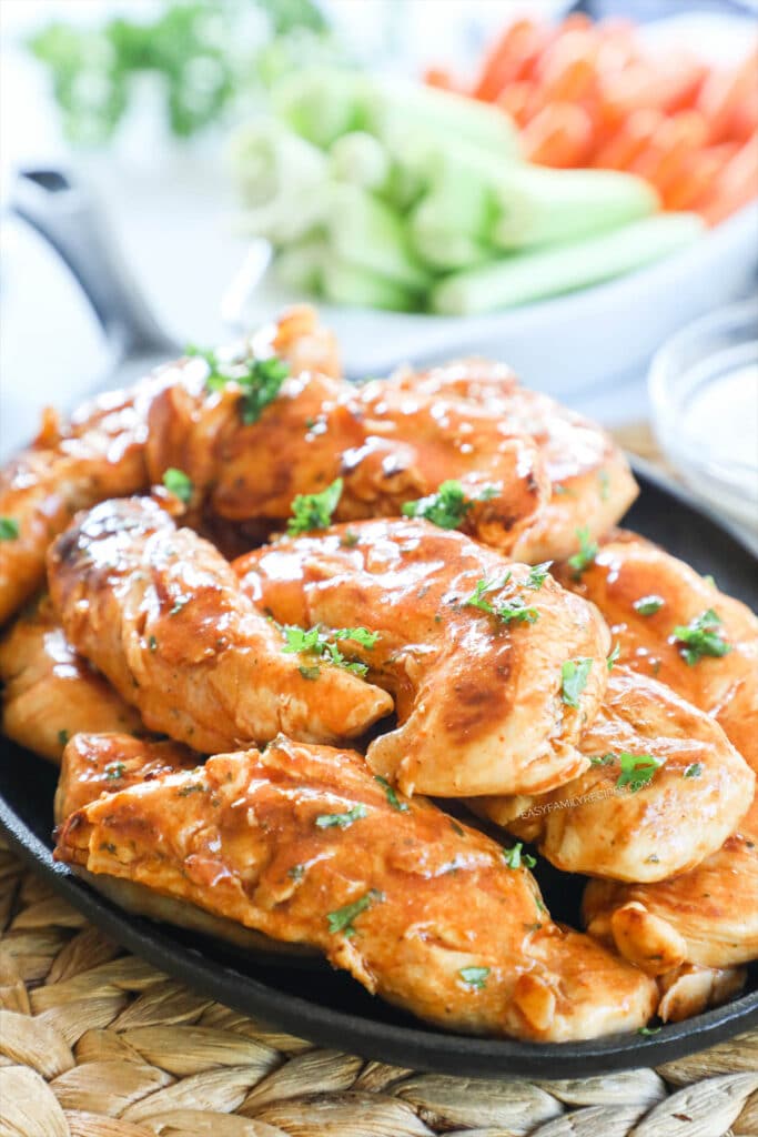 Buffalo Chicken Tenders Recipe prepared with homemade buffalo sauce and served on a platter for dinner.