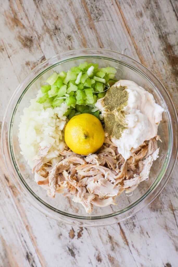 How to make chicken salad with rotisserie chicken step 2: place chicken in a bowl with mayonnaise, celery, onion, lemon juice and seasoning.