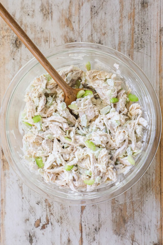 How to make chicken salad with rotisserie chicken step 3: Mix the chicken with the dressing until chicken is coated.