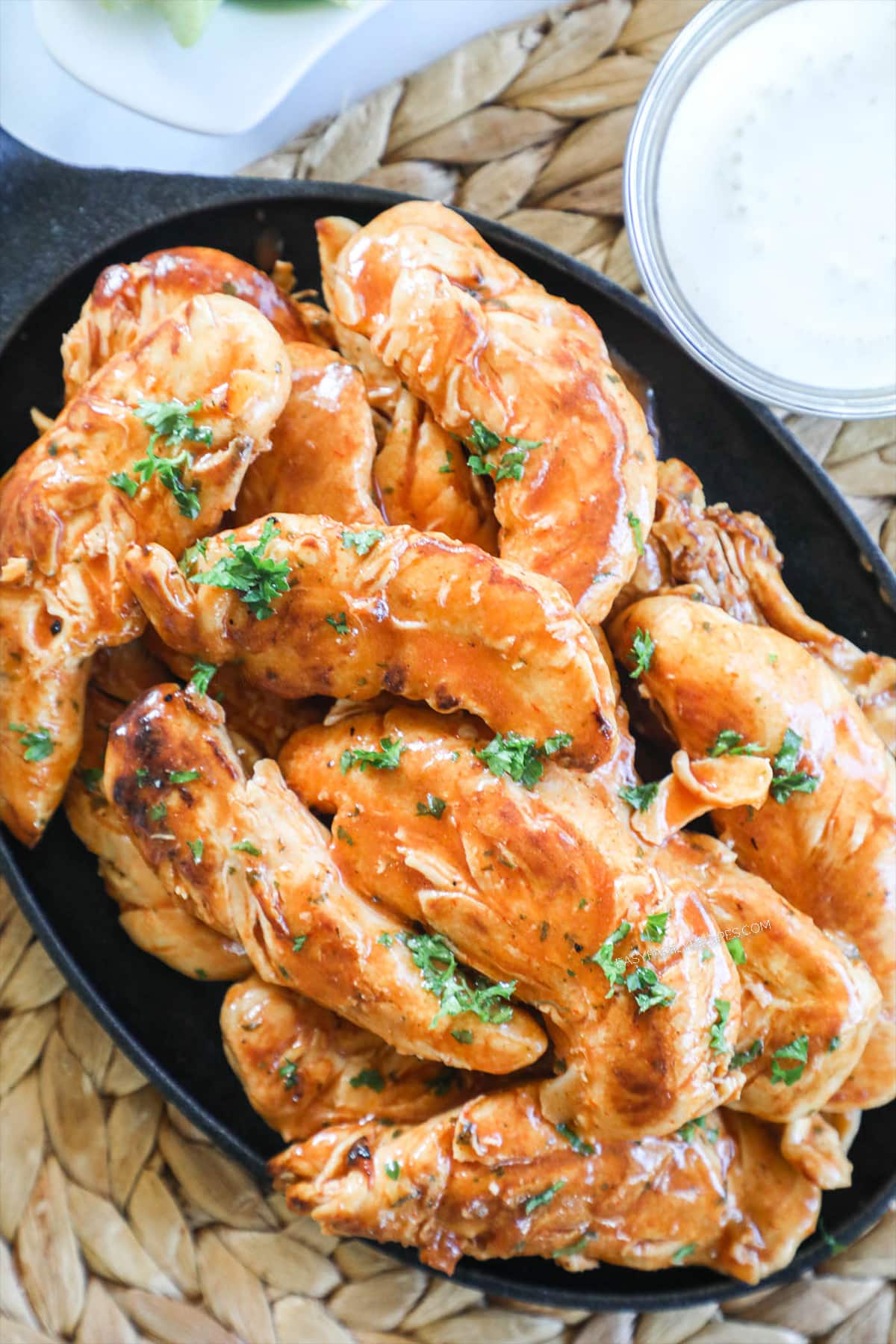 Homemade Buffalo Chicken Tenders in a skillet.