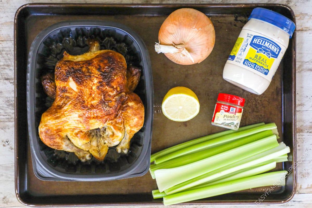 ingredients to make chicken salad with rotisserie chicken, celery, lemon, onion, mayo, and poultry seasoning
