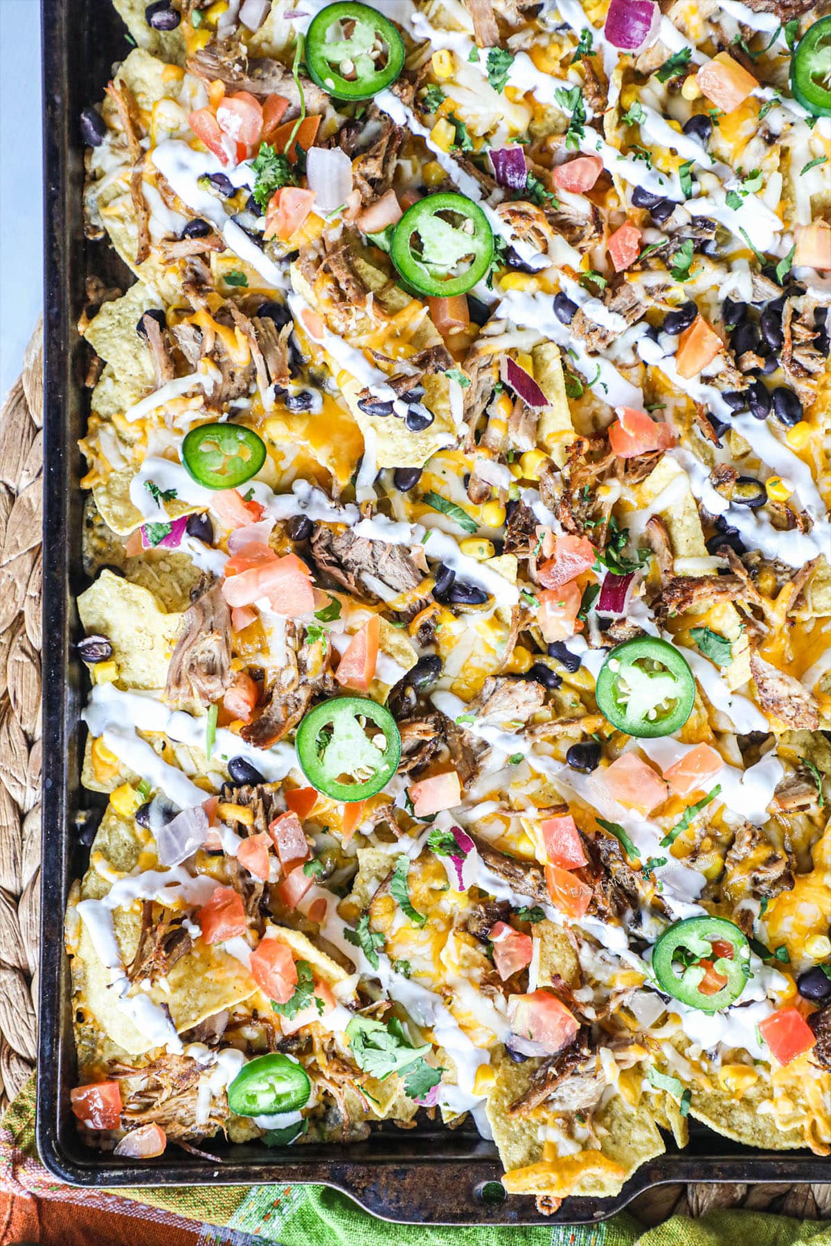 sheet pan with loaded carnitas nachos