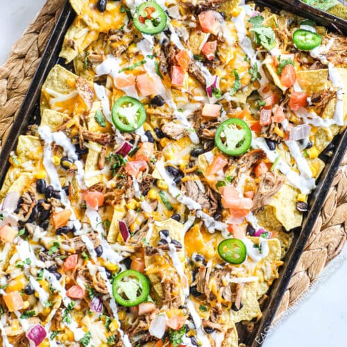 sheet pan with loaded carnitas nachos