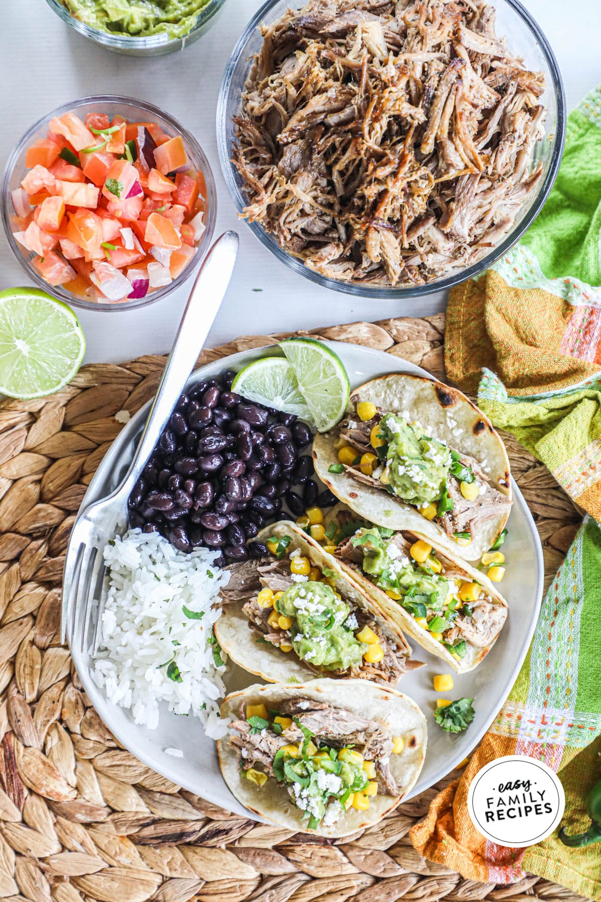 Pork carnitas served on tortillas with rice and beans