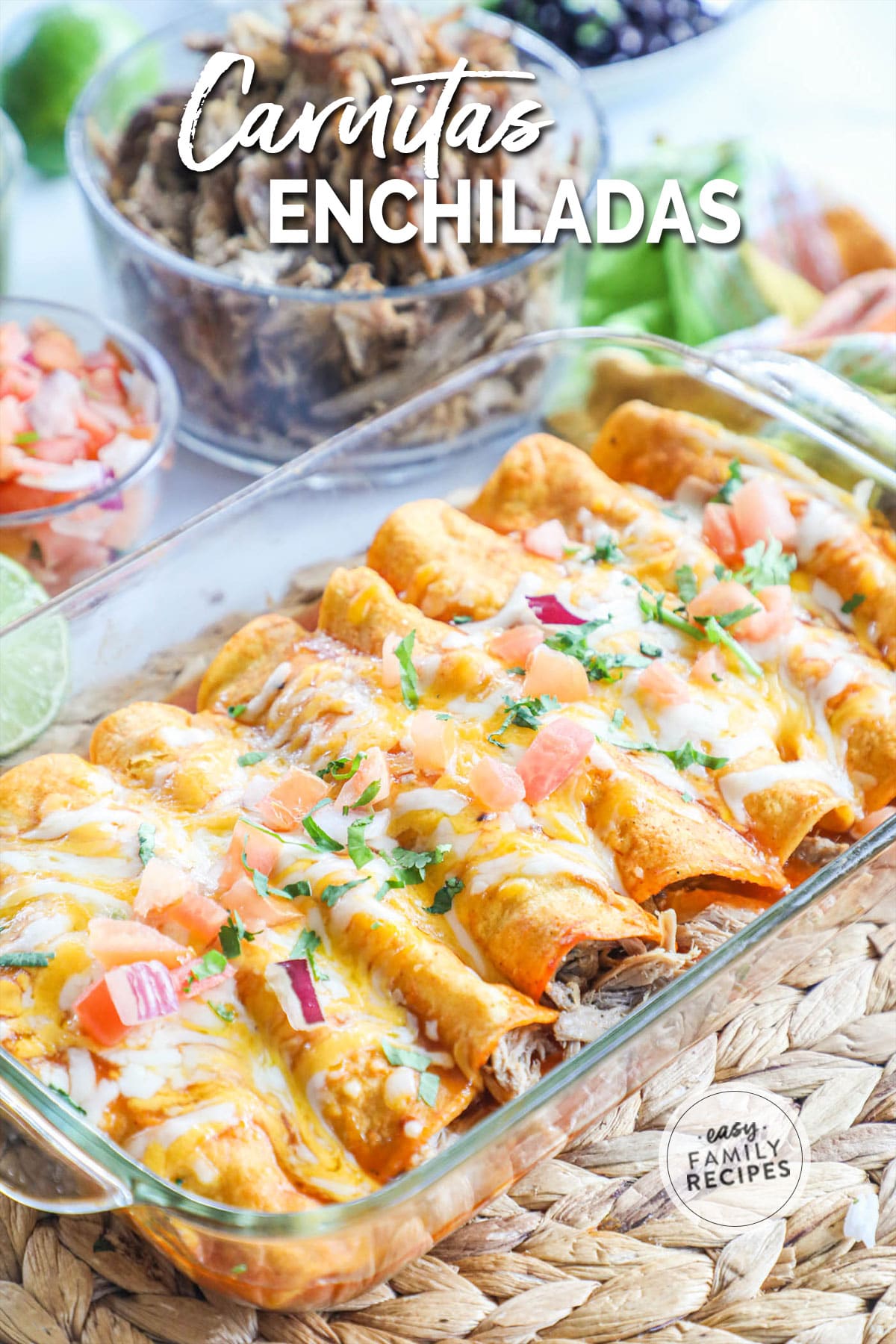 glass baking dish with corn tortillas filled with pork carnitas and a dish of pico de gallo