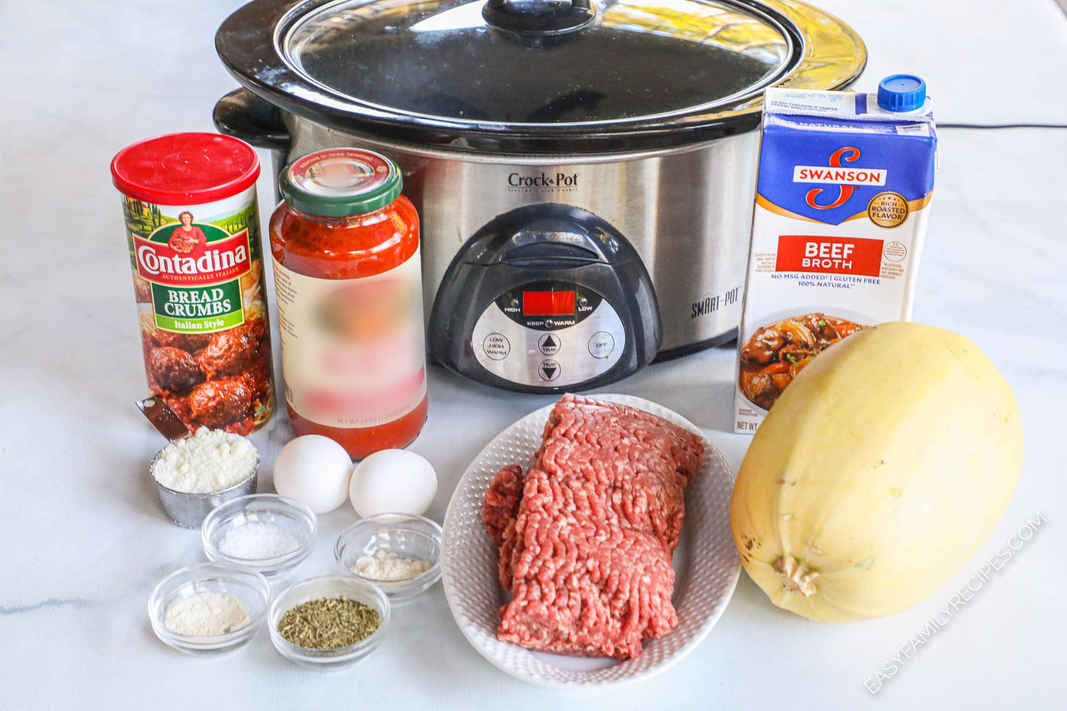 Ingredients for Spaghetti Squash and Meatballs including spaghetti squash, ground beef, eggs, seasonings, spaghetti sauce