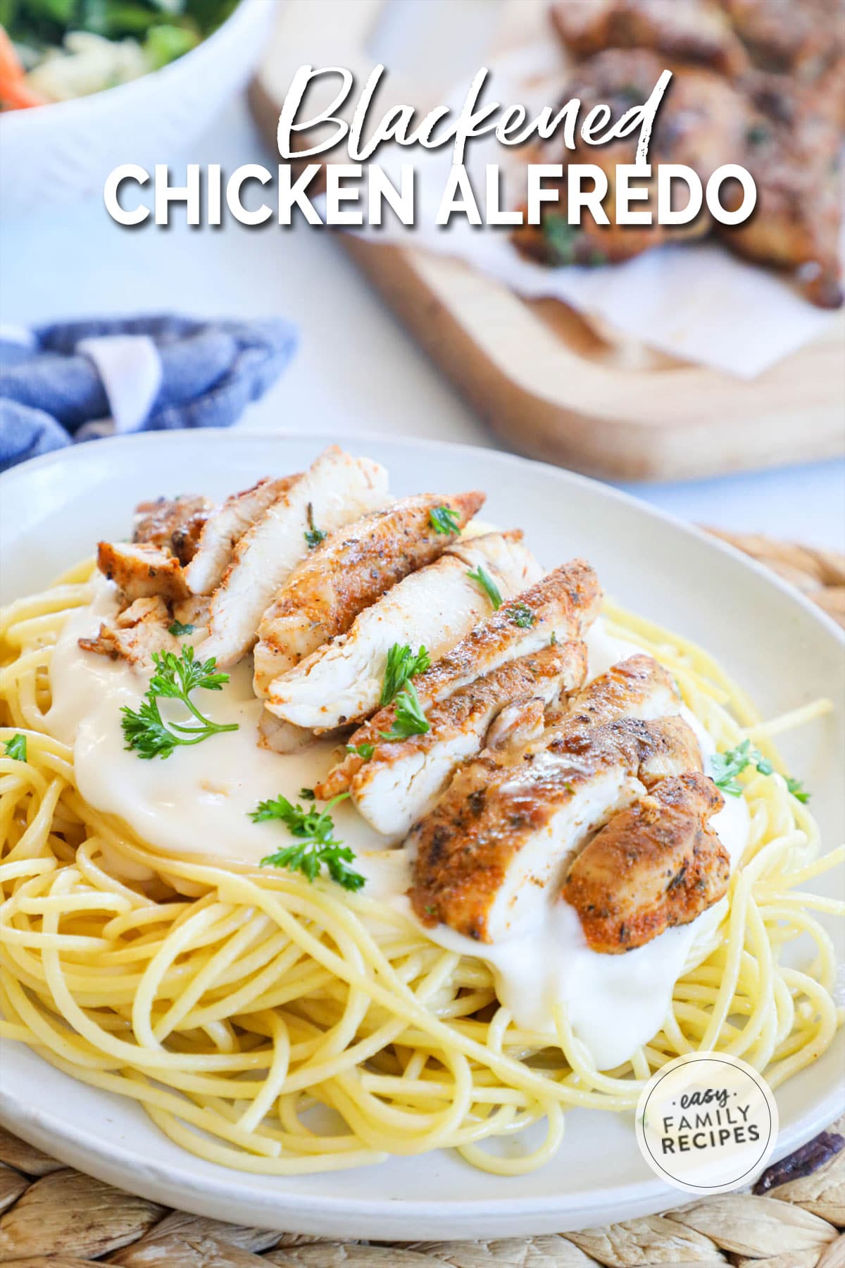 A serving of homemade blackened chicken alfredo pasta on a plate