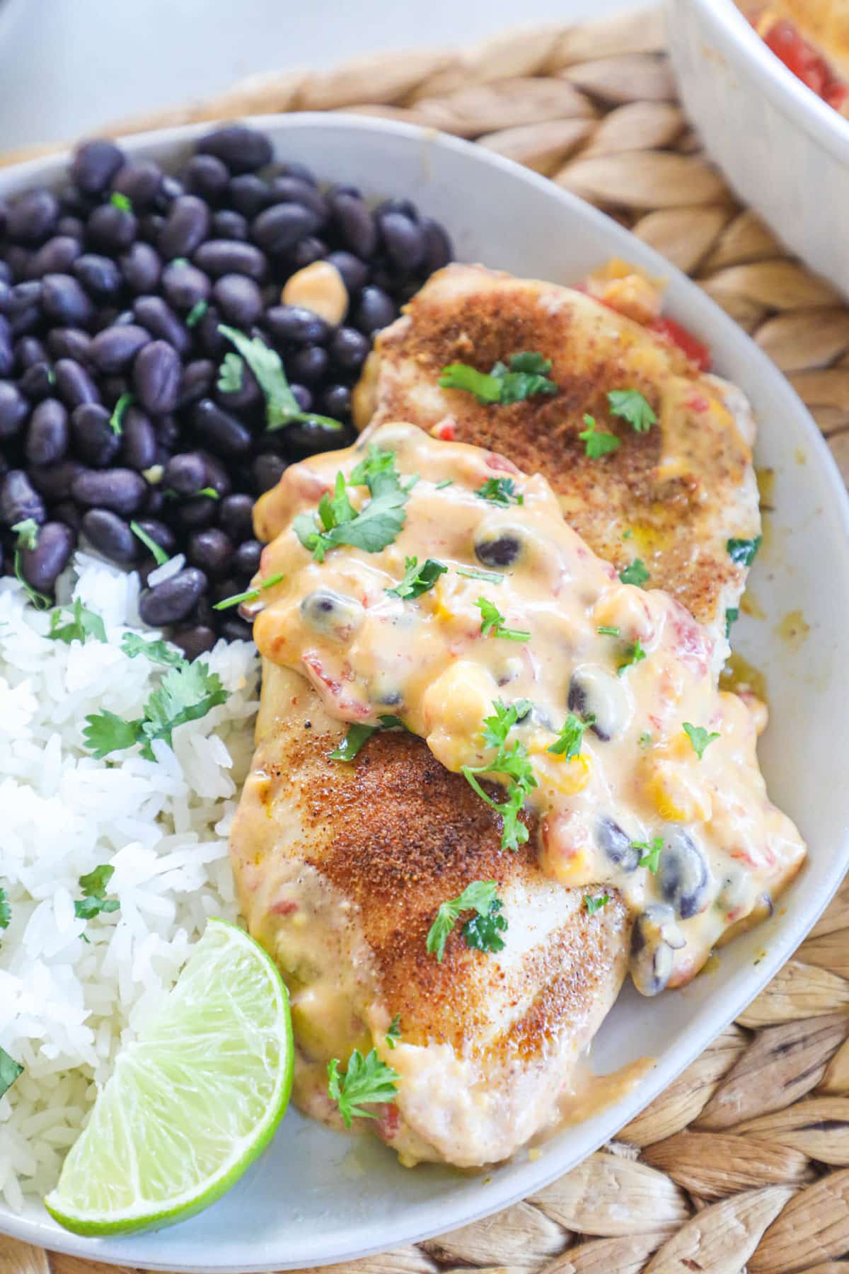Queso Chicken served with black beans and rice for an easy weeknight dinner.