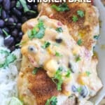 Close up of chicken breast smothered in queso.