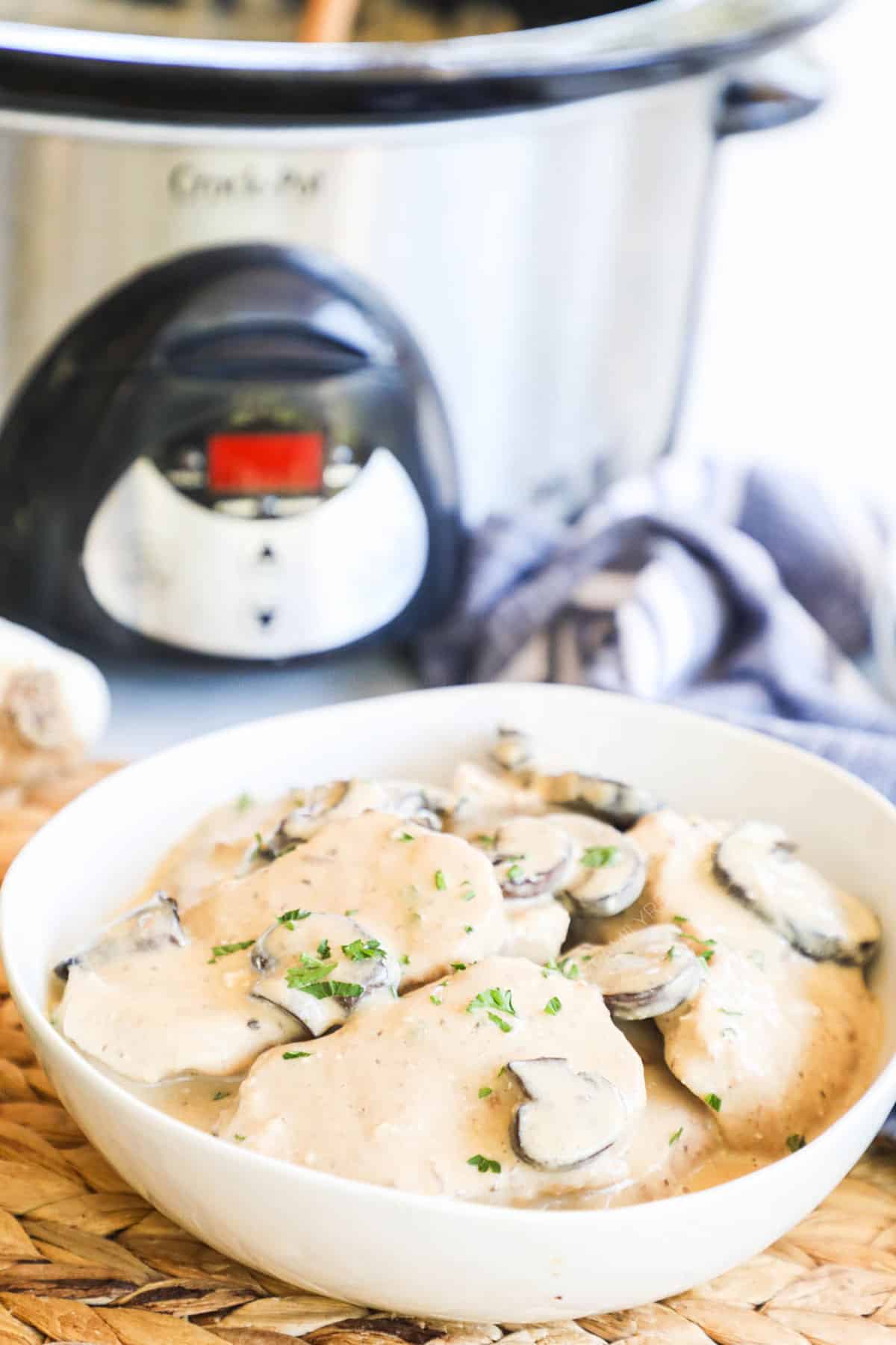 Gravy smothered pork chops made in the crockpot.