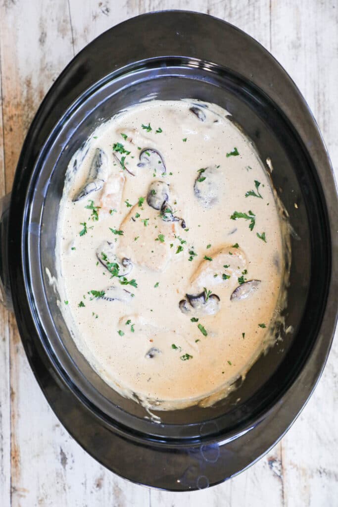 How to make crockpot smothered pork chops step 4: Cover and cook pork chops until they are tender.