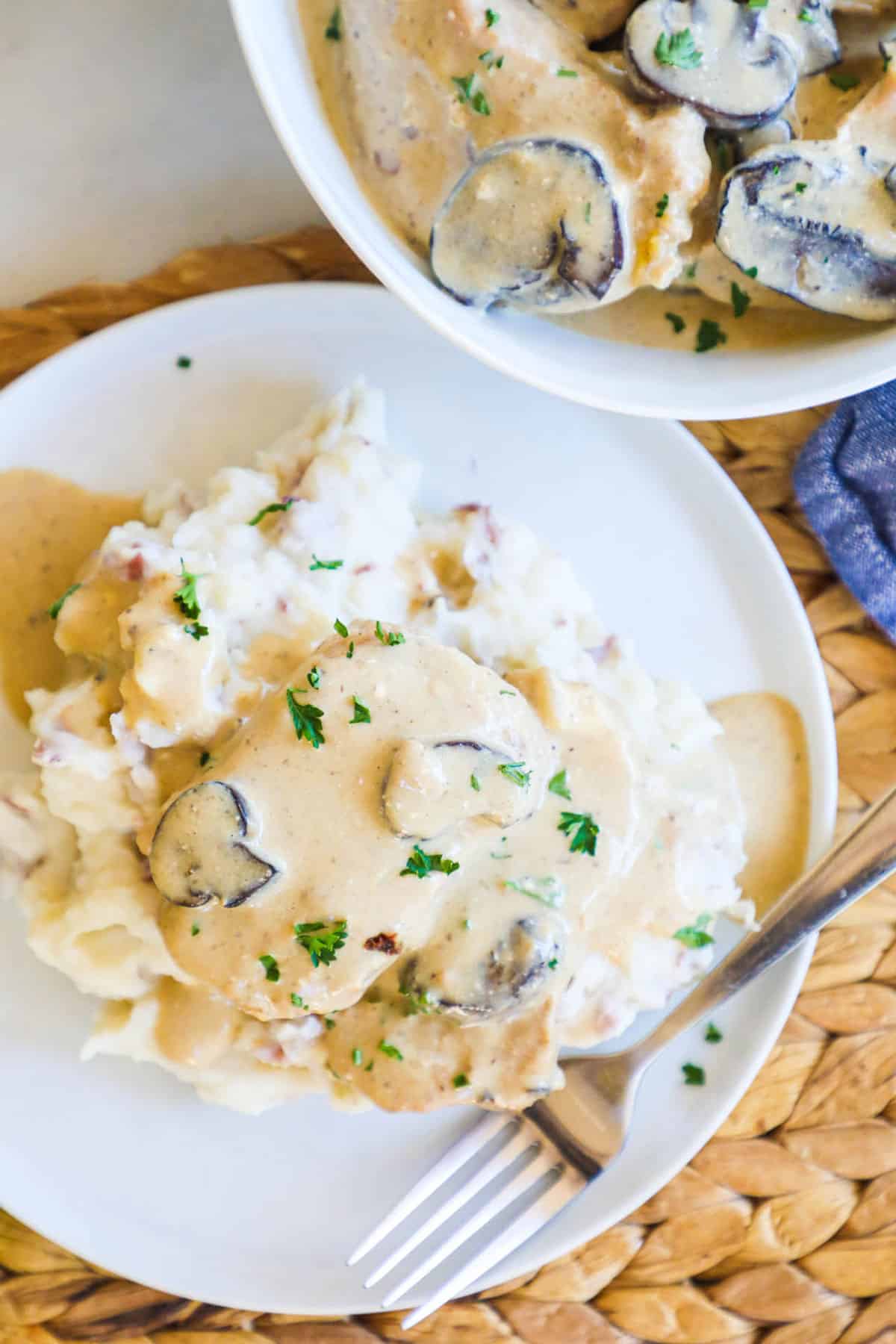 Gravy smothered Boneless Pork Chops served over mashed potatoes.