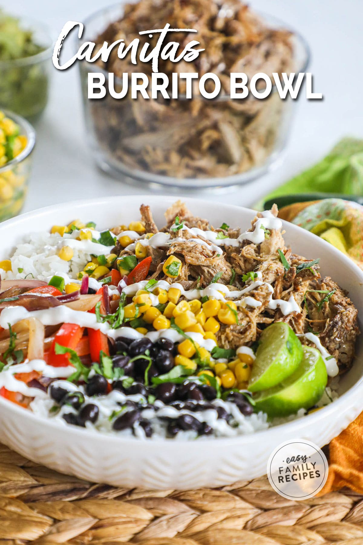 A pork carnitas bowl with pico de gallo, avocado, corn, black beans, and sour cream.