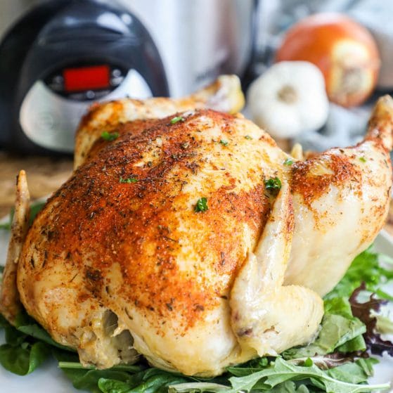 A whole chicken cooked rotisserie style in a slow cooker
