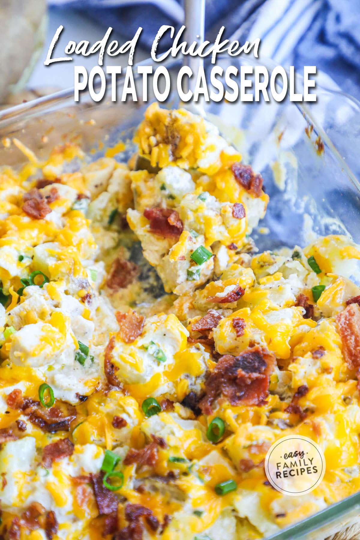 Close up of loaded baked potato chicken casserole being scooped out of a pan.