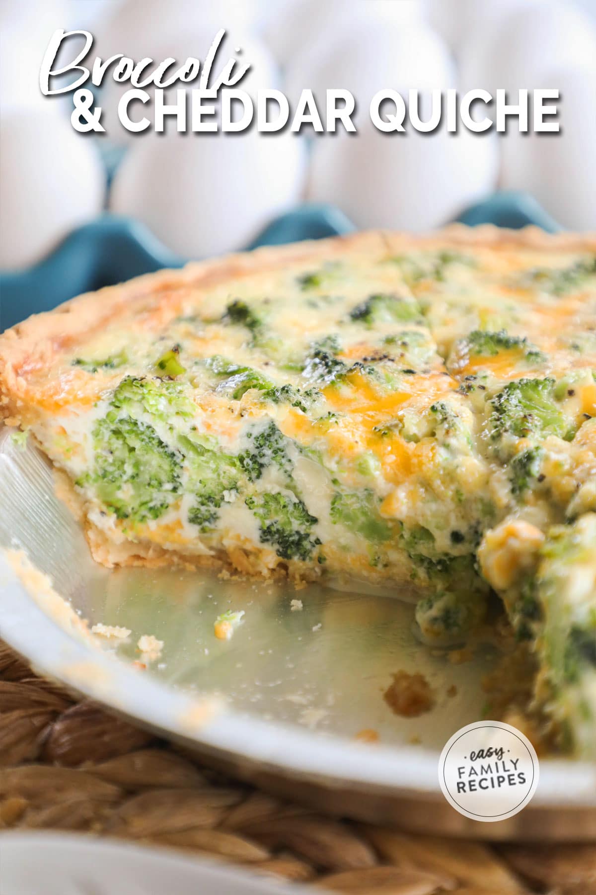 Close up image of quiche with a few slices taken out of it so you can see the inside packed with broccoli, cheese, and eggs.