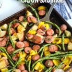 Sheet Pan dinner with smoked sausage, potatoes, and green beans.