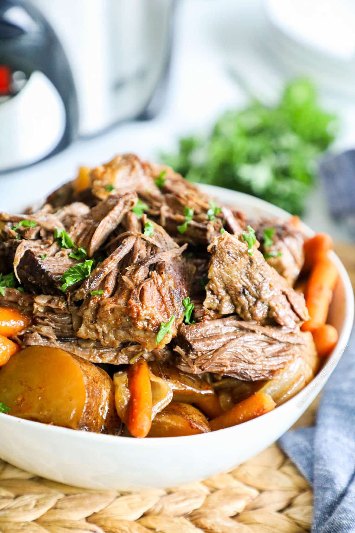 Close up of tender juicy southern pot roast with potatoes and carrots