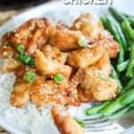 Plate of Honey Sesame Chicken Bites served over rice.