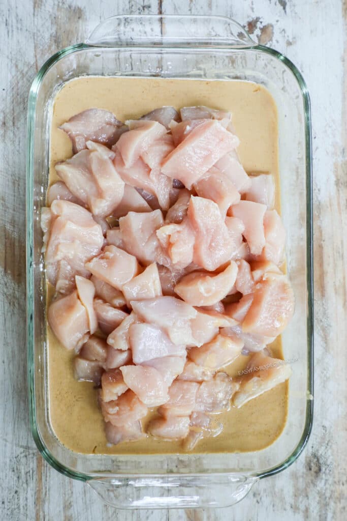 How to make honey sesame chicken step 1: cut chicken breast into pieces and prepare marinade.