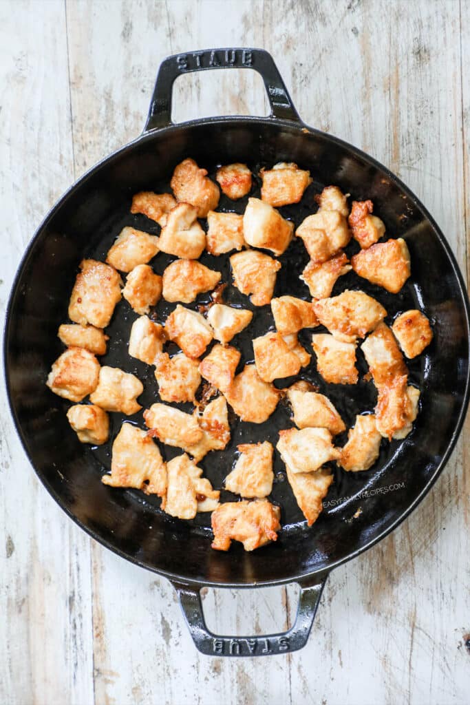 Cook the chicken in a skillet until browned.