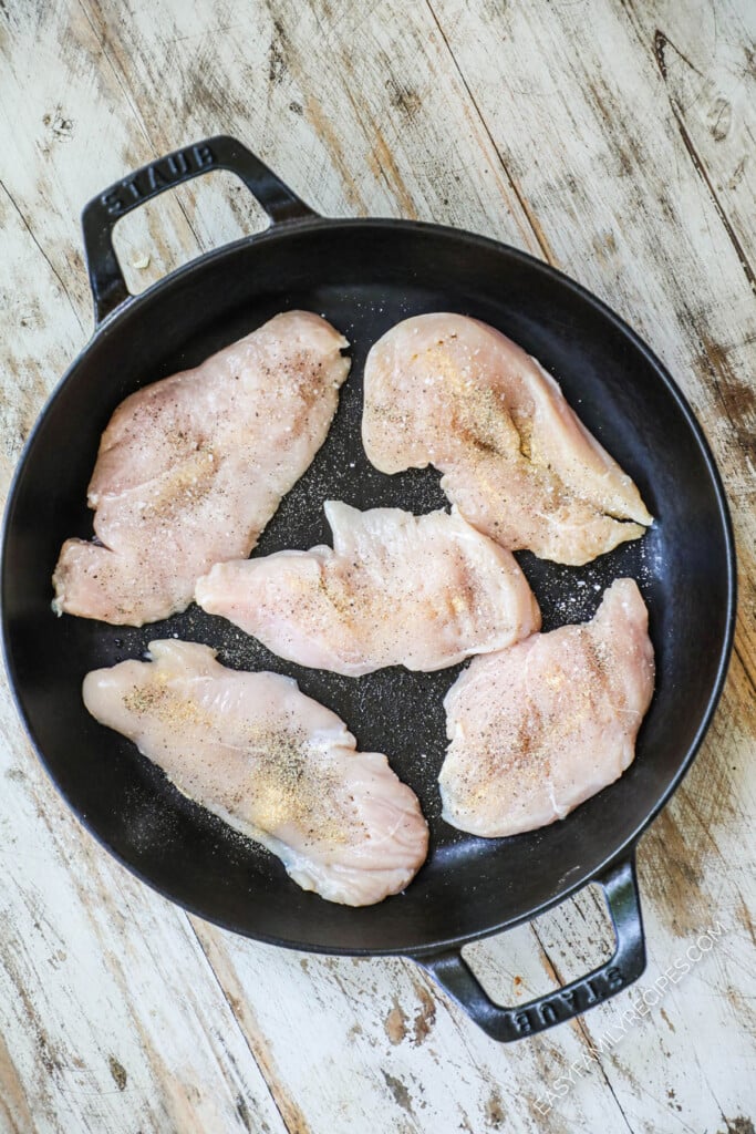 How to Make Sun Dried Tomato Basil Chicken Step 1: Season chicken breast and place in hot pan.