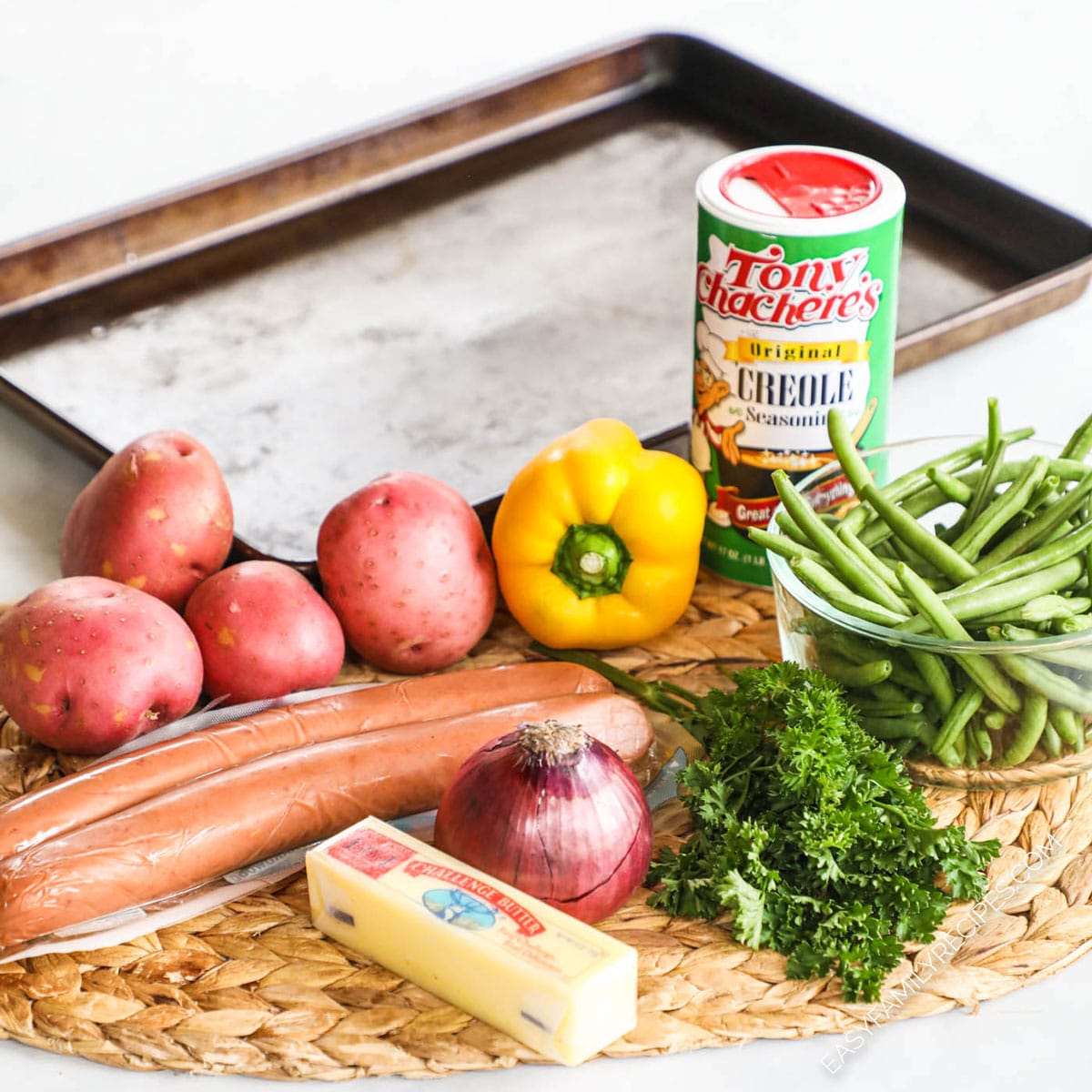 Sheet Pan Sausage & Veggies with Cajun Butter Sauce · Easy Family