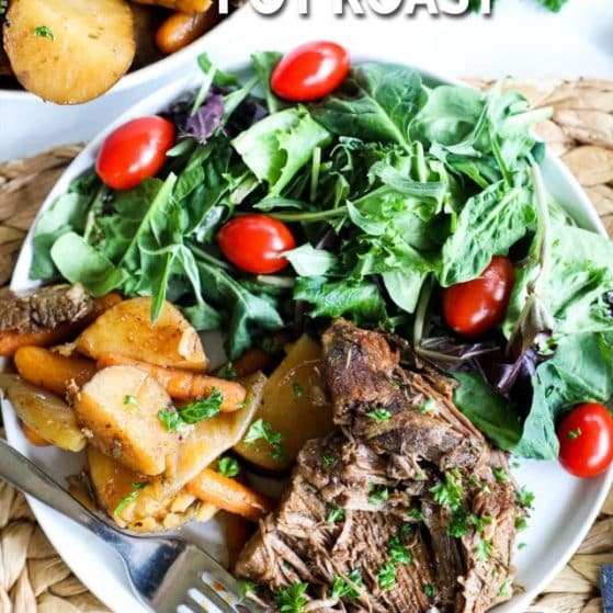 A beef pot roast dinner with potatoes, carrots, and a green salad